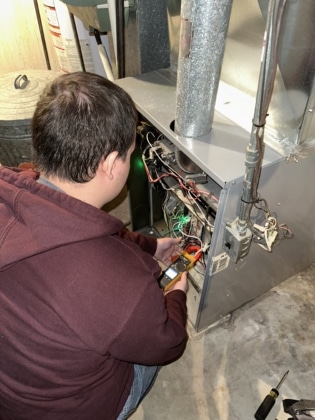 Steve's Technician maintaining a furnace.